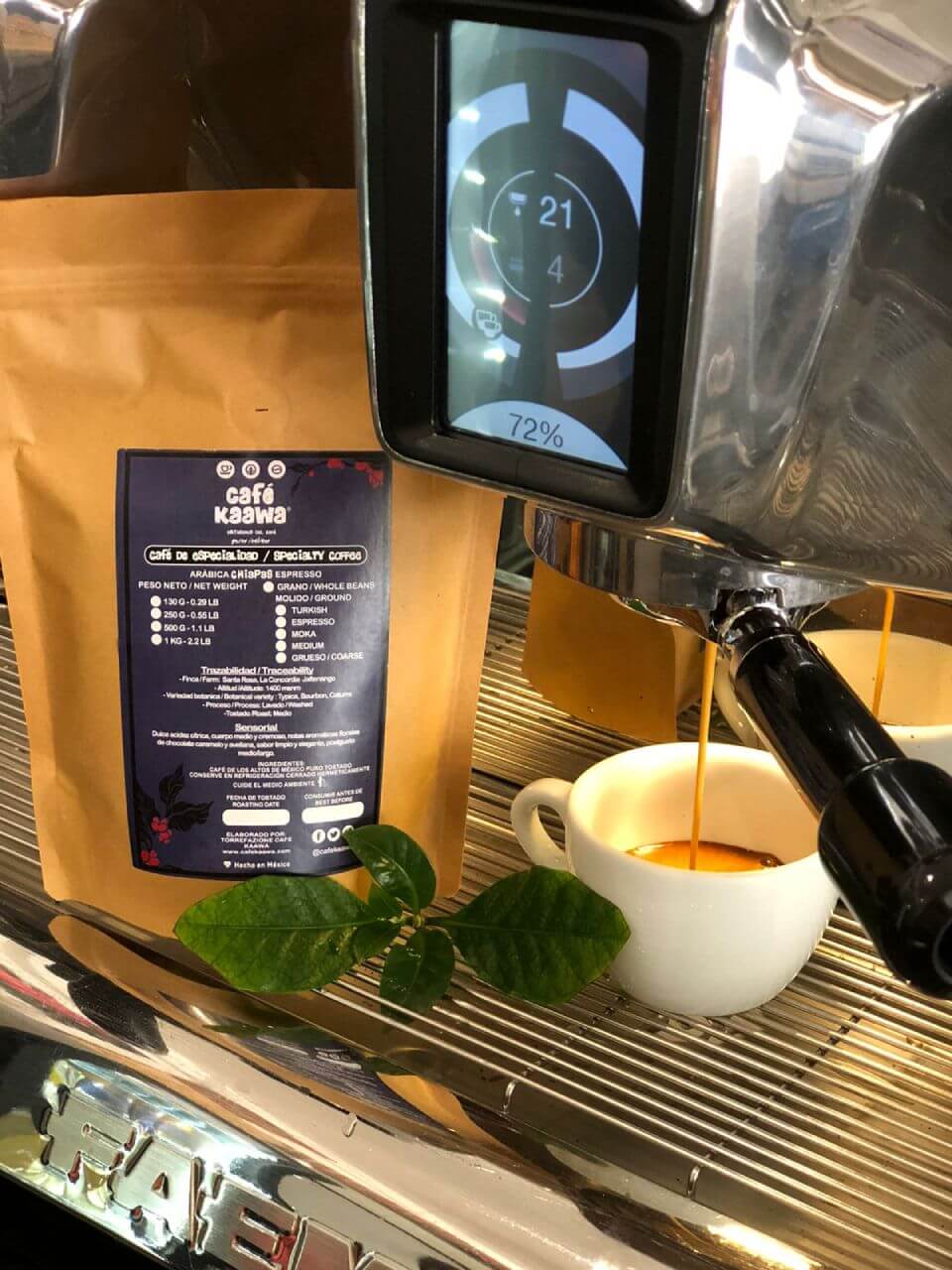 Espresso machine pouring coffee into 2 small coffee cups, besides a bag of Specialty Coffee Chiapas Jaltenango